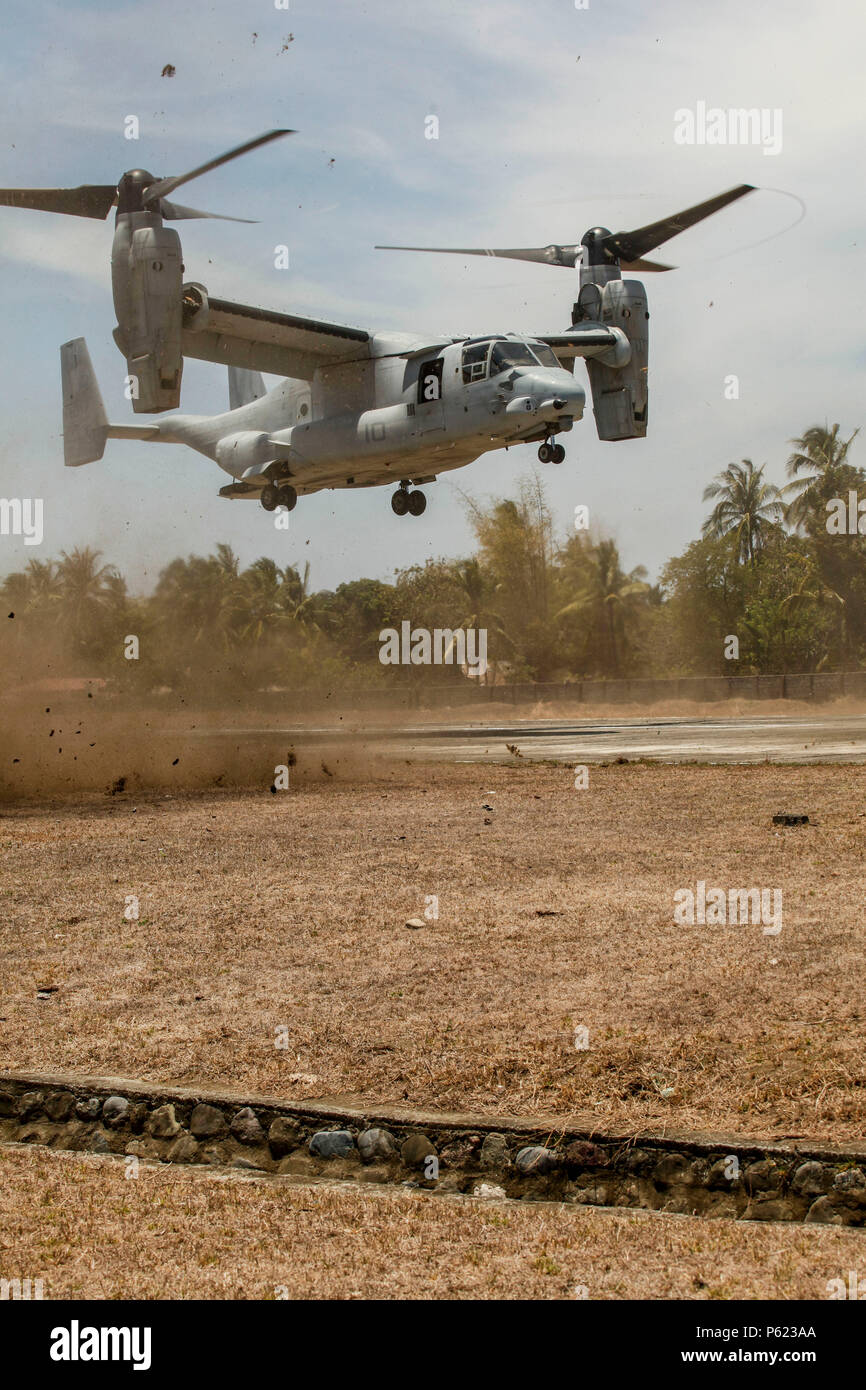 An MV-22 Osprey, tilt rotor aircraft, lands to insert the Joint Rapid Reaction Force (JRRF) at the Antique Air Field in order to seize a scenario-based objective as part of Exercise Balikatan 2016, in Antique, Philippines, April 11, 2016. The JRRF, compiled of U.S. and Philippine forces, have worked together during the exercise to test their capabilities, maintain a high level of interoperability and to enhance combined combat readiness. Balikatan, which means 'shoulder to shoulder' in Filipino, is an annual bilateral training exercise aimed at improving the ability of Philippine and U.S. mili Stock Photo