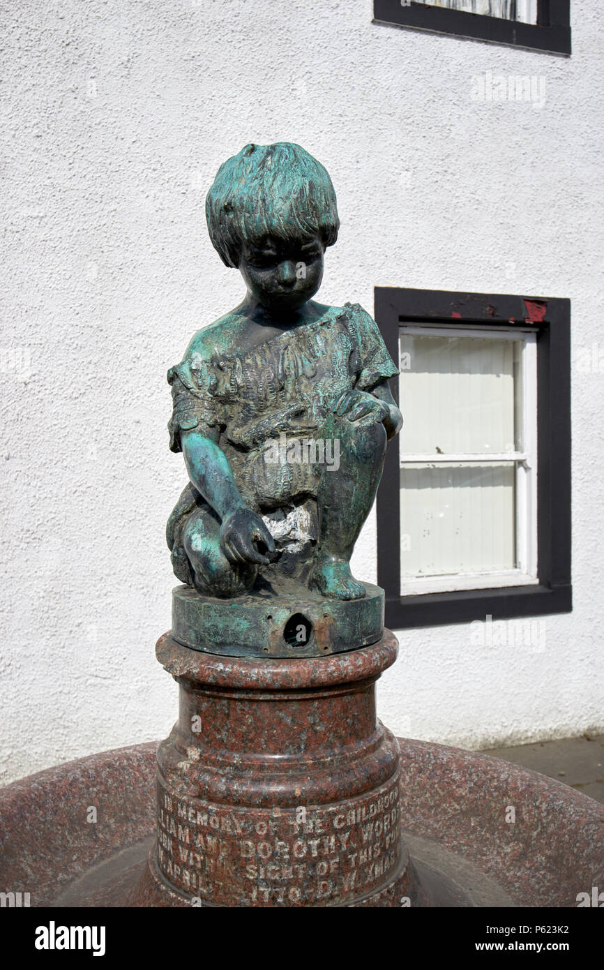 drinking fountain and childs bronze figure in honour of william and dorothy wordsworth wordsworth memorial Cockermouth Cumbria England UK Stock Photo