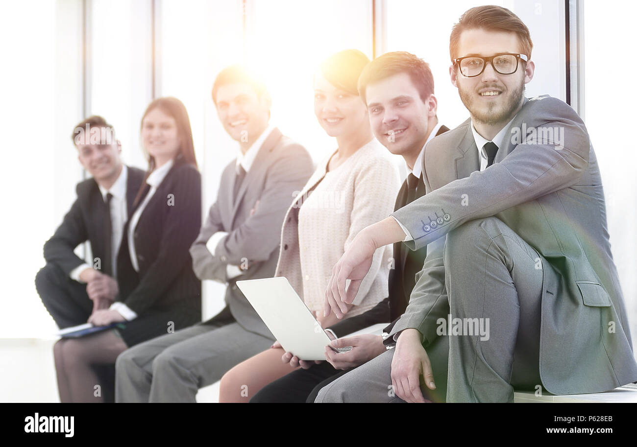business team sitting in the lobby of the office Stock Photo - Alamy