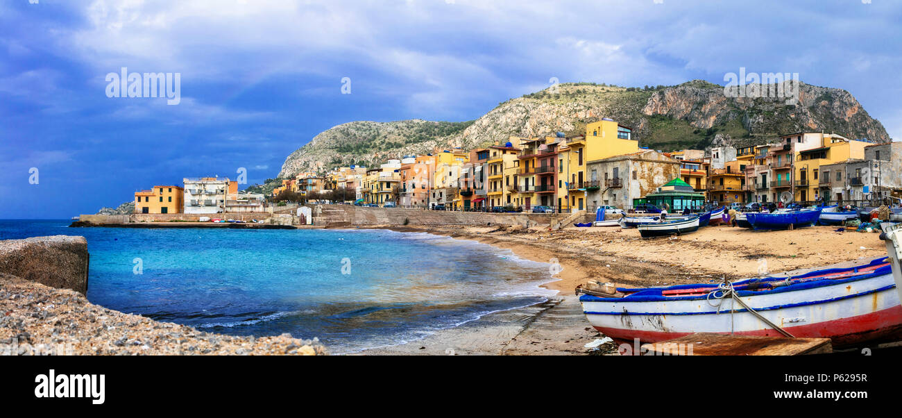 Traditional fishing boats and colorful houses in Aspra village,Bagheria,Sicily,Italy Stock Photo