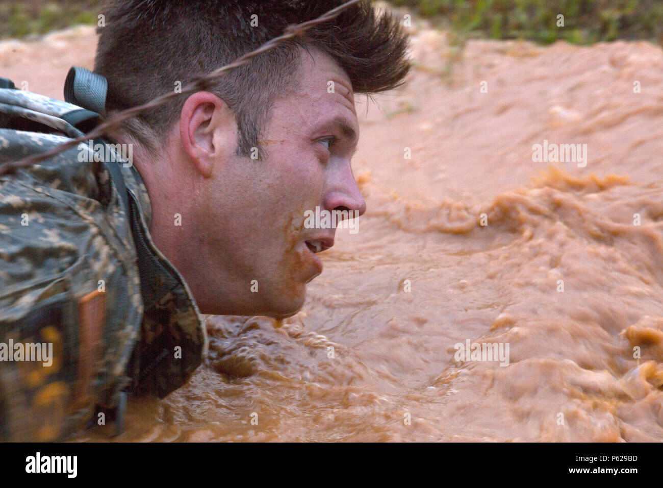 U.S. Army Staff Sgt. Stewart Fletcher, Airborne and Ranger Training  Brigade, completes a water obstacle at the Malvesti Obstacle Course during  the Best Ranger Competition, Ft. Benning, Ga., April 15, 2016. Fort