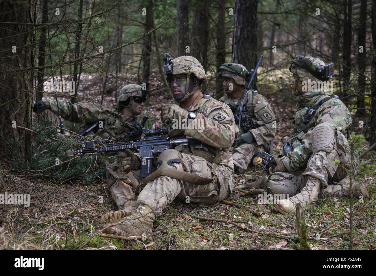 U.S. Soldiers of Able Company, 2nd Battalion, 503rd Infantry Regiment, 173rd Airborne Brigade conduct a tactical pause during a counter reconnaissance offensive operational scenario during exercise Saber Junction 16 at the U.S. Army’s Joint Multinational Readiness Center (JMRC) in Hohenfels, Germany, April 14, 2016. Saber Junction 16 is the U.S. Army Europe’s 173rd Airborne Brigade’s combat training center certification exercise, taking place at the JMRC in Hohenfels, Germany, Mar. 31-Apr. 24, 2016.  The exercise is designed to evaluate the readiness of the Army’s Europe-based combat brigades  Stock Photo