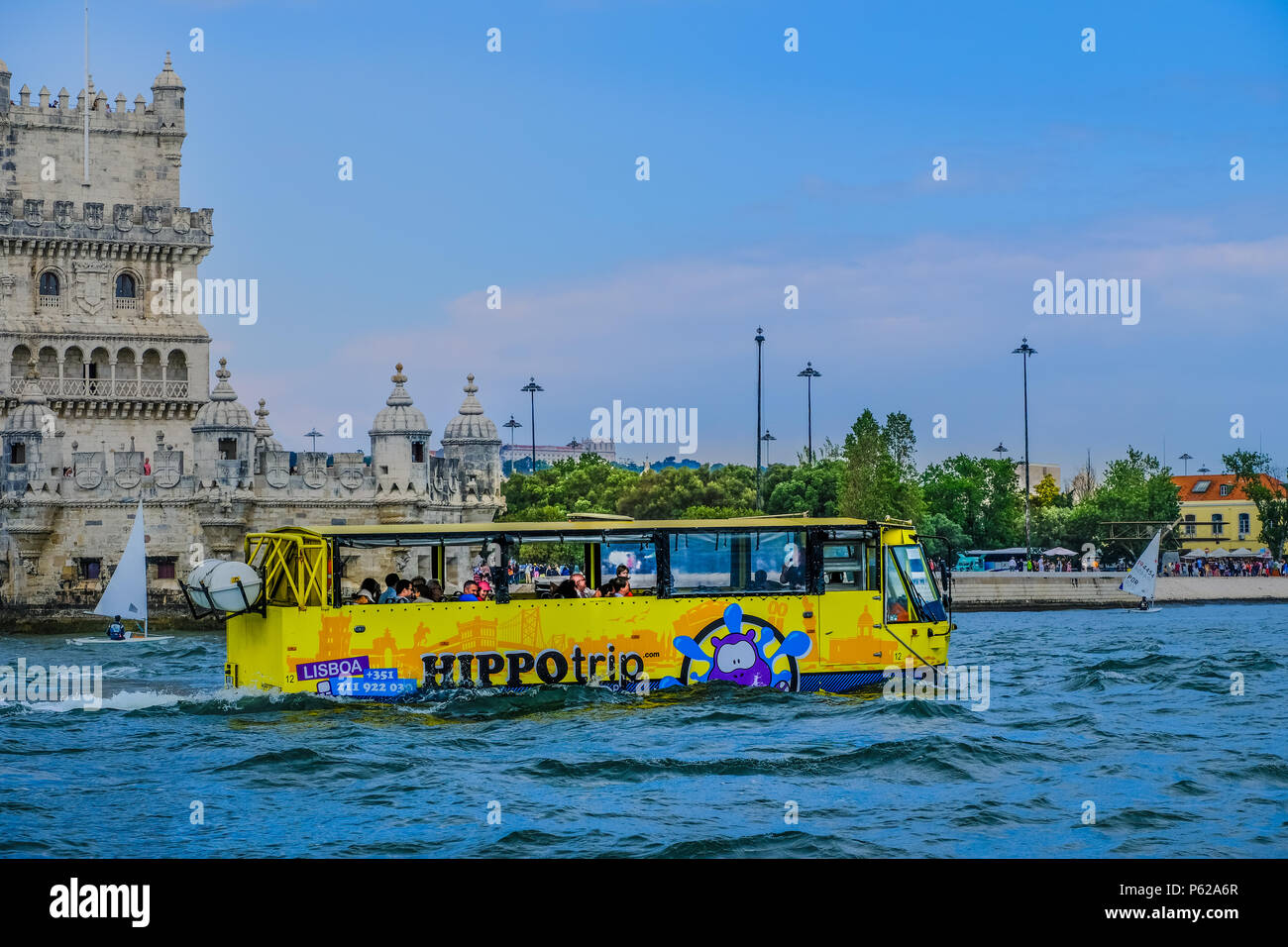 Lisbon, Portugal, May 26, 2018; View of amphibian vehicle Hippo giving tour along Tagus River with Belém Tower and other city buildings in background Stock Photo