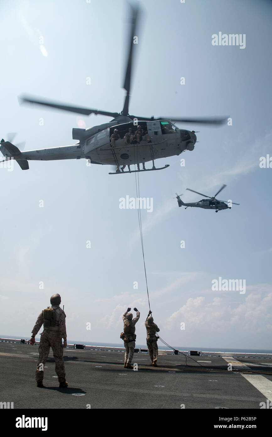 AT SEA (April 1, 2016)-U.S. Marines with the 13th Marine Expeditionary Unit, conduct rappel training, April 1, 2016, during the MEU's western pacific deployment aboard the USS Boxer. More then 4,500 Marines and Sailors from the Boxer ARG, 13th MEU team are currently transiting the Pacific Ocean toward the U.S. 5th fleet area of operations during a scheduled deployment. (U.S. Marine Corps photo by Sgt. Briauna Birl/RELEASED) Stock Photo