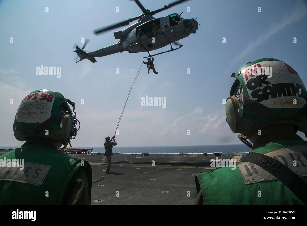 AT SEA (April 1, 2016)-U.S. Marines with the 13th Marine Expeditionary Unit, conduct rappel training, April 1, 2016, during the MEU's western pacific deployment aboard the USS Boxer. More then 4,500 Marines and Sailors from the Boxer ARG, 13th MEU team are currently transiting the Pacific Ocean toward the U.S. 5th fleet area of operations during a scheduled deployment. (U.S. Marine Corps photo by Sgt. Briauna Birl/RELEASED) Stock Photo