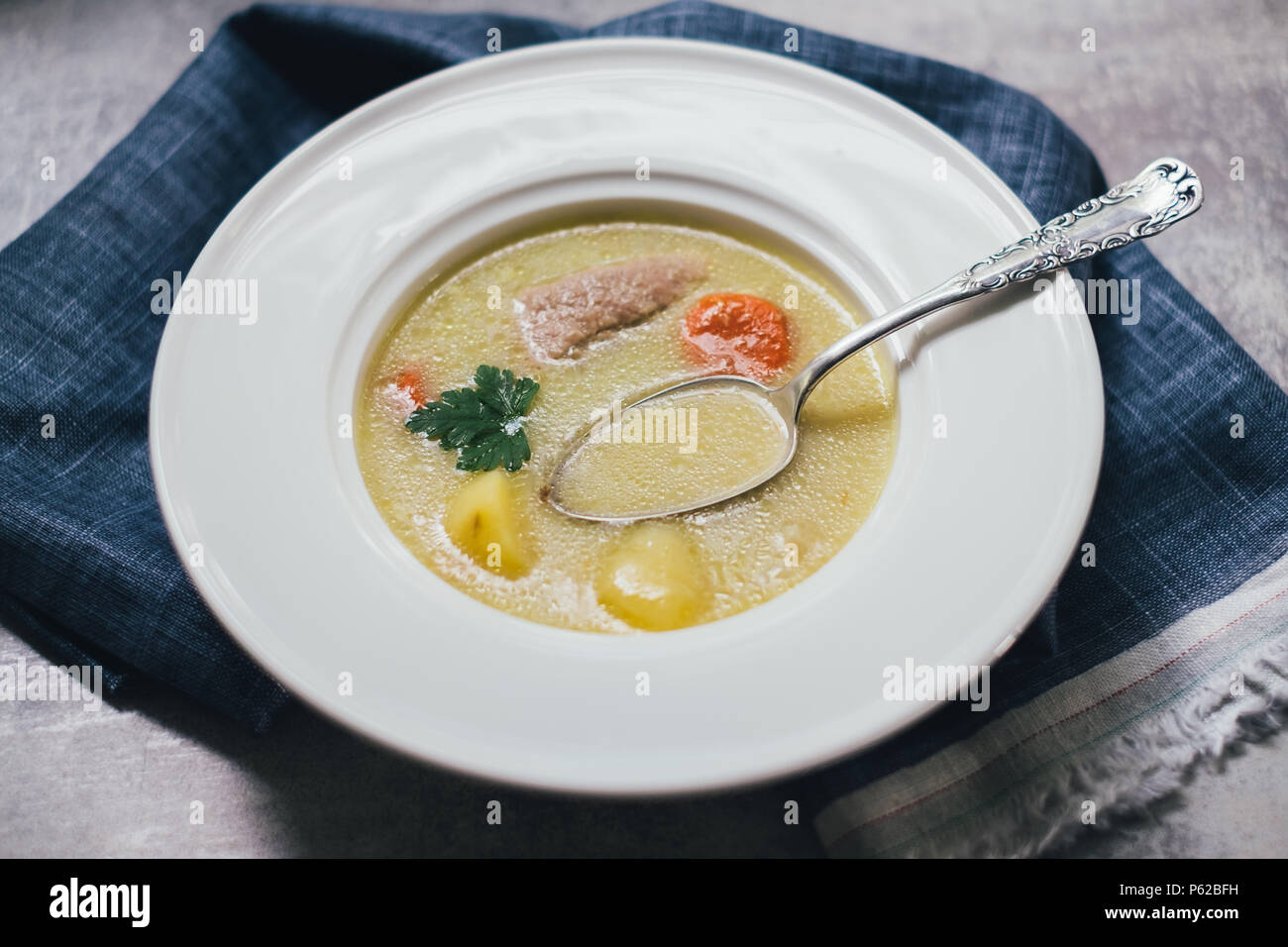 Soup with potato and pork meat Stock Photo
