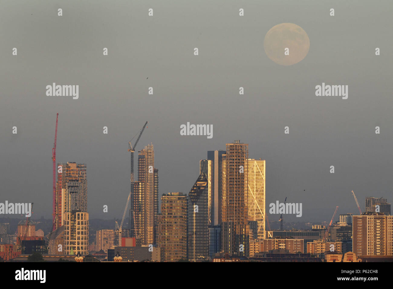 The view from Parliament Hill in Hampstead, London of the moon rising