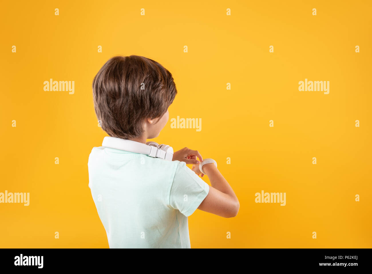 Smart boy wearing a modern watch Stock Photo Alamy