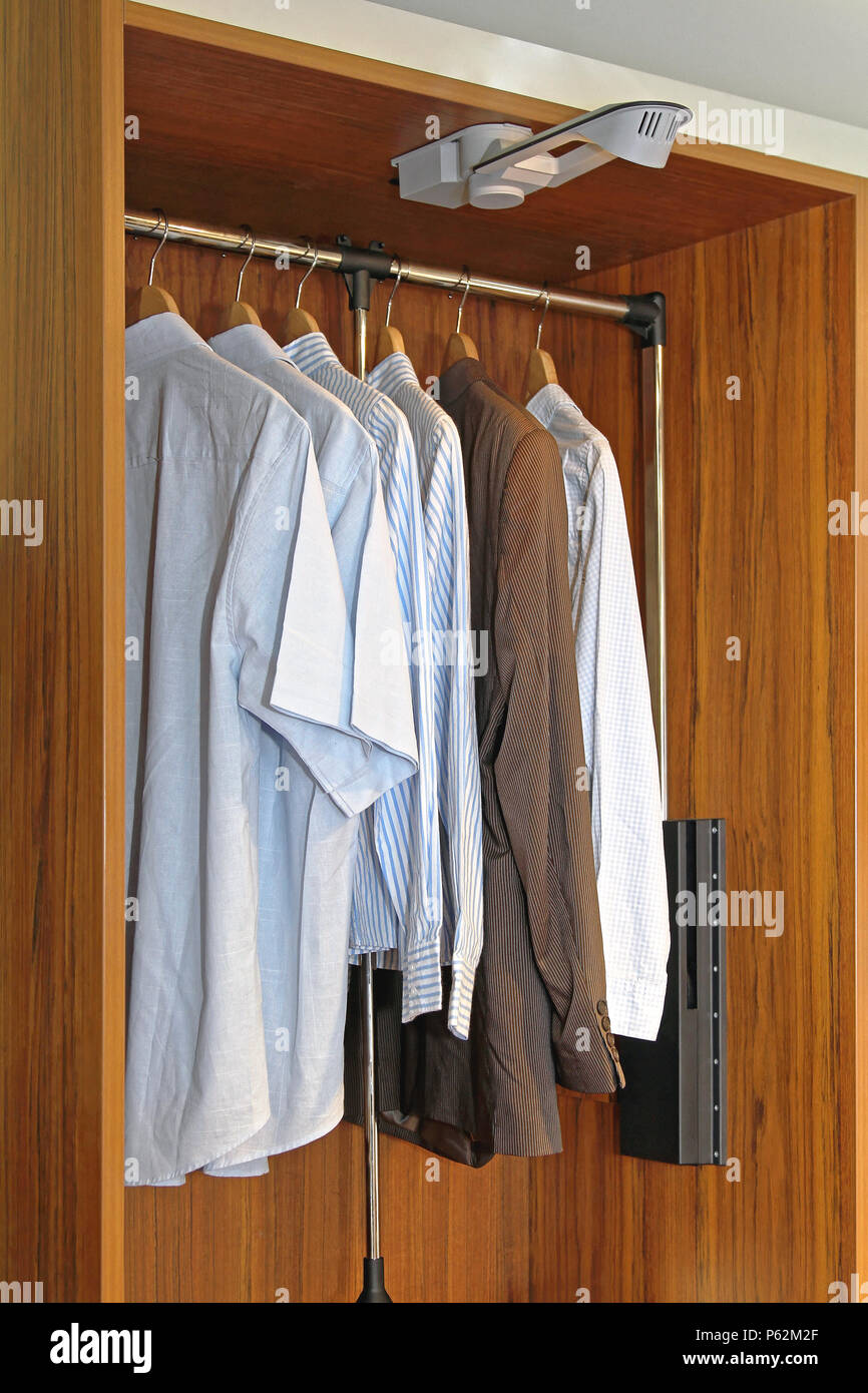Mens Wardrobe Closet With Shirts And Suit Stock Photo 210272007