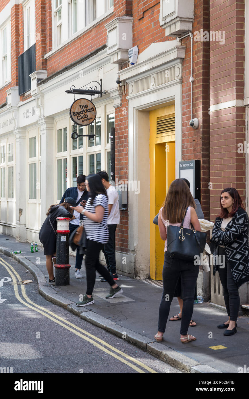 Diners waiting to get into The Breakfast Club restaurant in Artillery Lane, Spitalfields, London, England Stock Photo