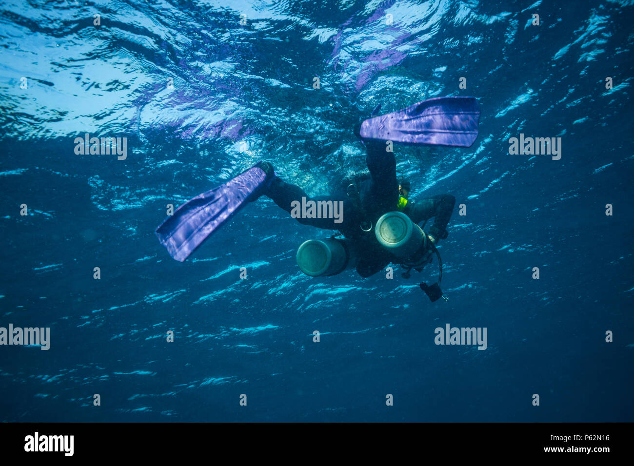 Scubadiver in a sidemount configuration of equipment Stock Photo