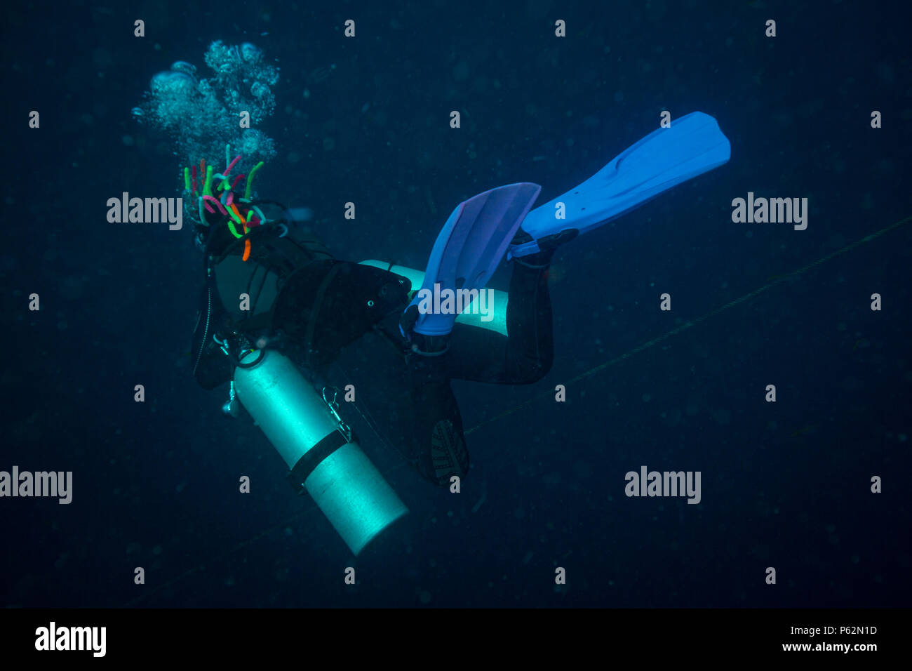 Scubadiver in a sidemount configuration of equipment Stock Photo - Alamy