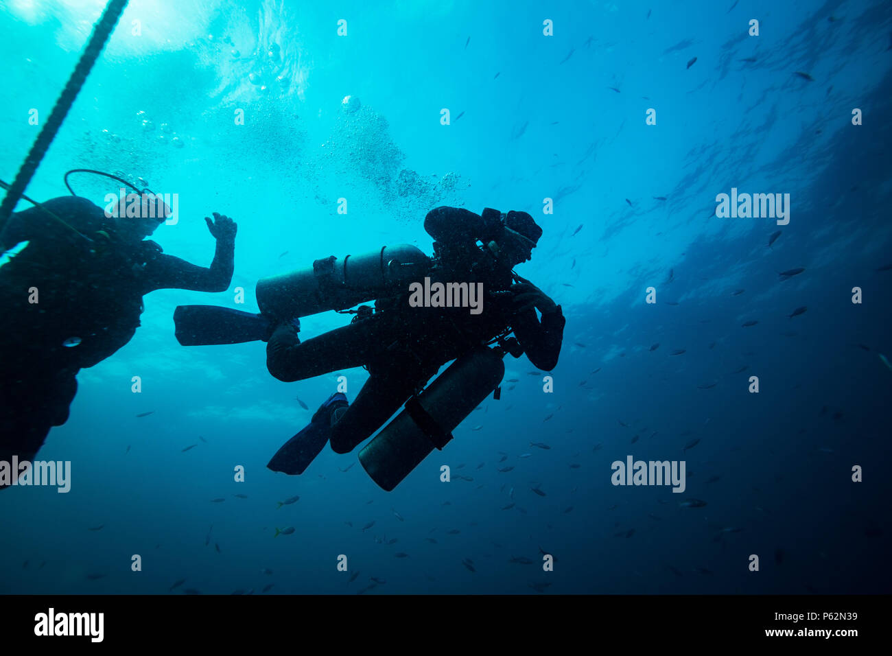 Scubadiver in a sidemount configuration of equipment Stock Photo - Alamy
