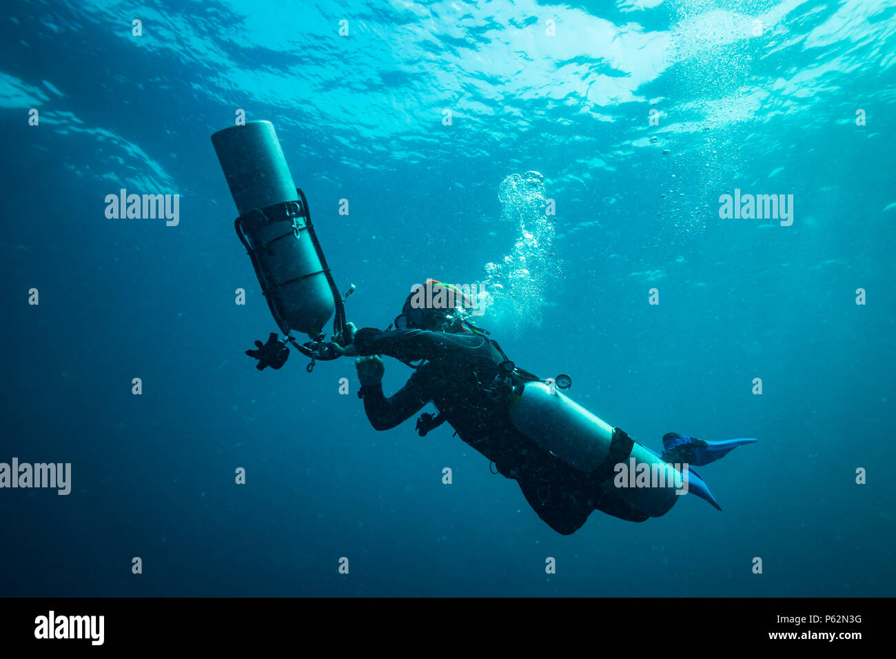Scubadiver in a sidemount configuration of equipment Stock Photo - Alamy