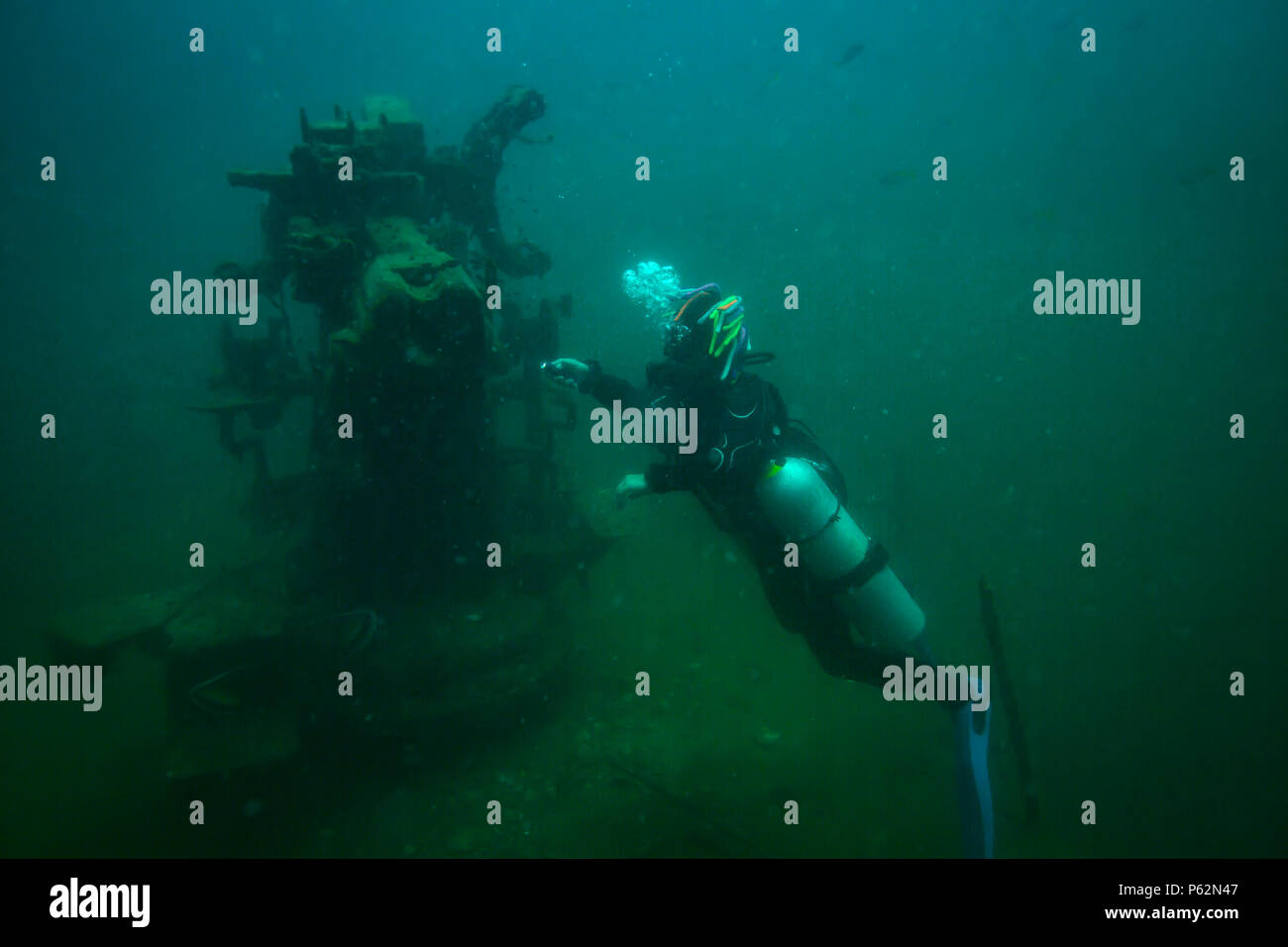 Scubadiver in a sidemount configuration of equipment Stock Photo - Alamy
