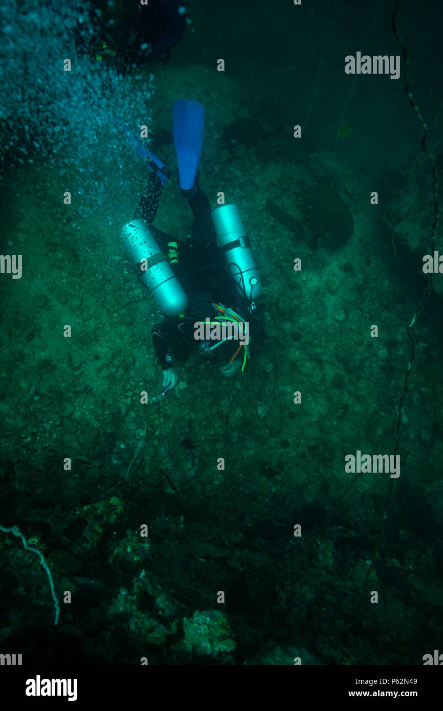Scubadiver in a sidemount configuration of equipment Stock Photo - Alamy