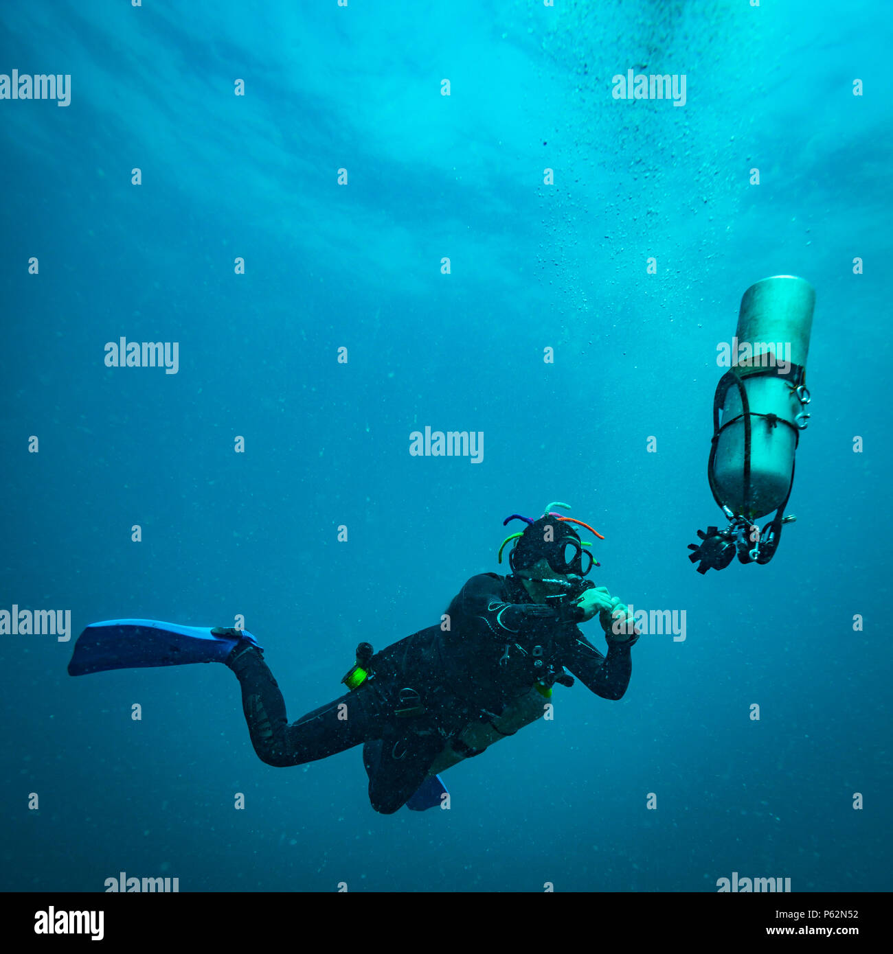 Scubadiver in a sidemount configuration of equipment Stock Photo - Alamy