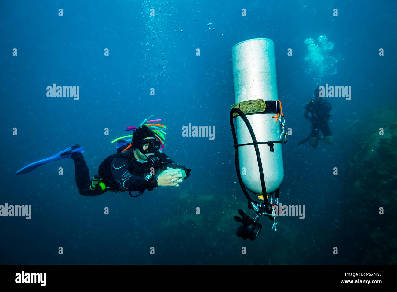 Scubadiver in a sidemount configuration of equipment Stock Photo - Alamy