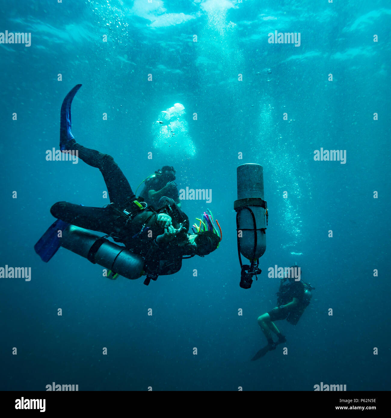 Scubadiver in a sidemount configuration of equipment Stock Photo