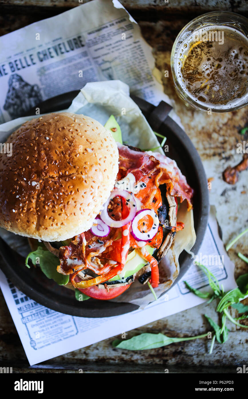 Delicious grilled portobello mushroom burger with a lot of veggies