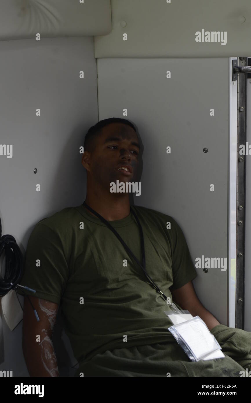 LCdr. James H. Flint assesses the injuries of a simulated patient