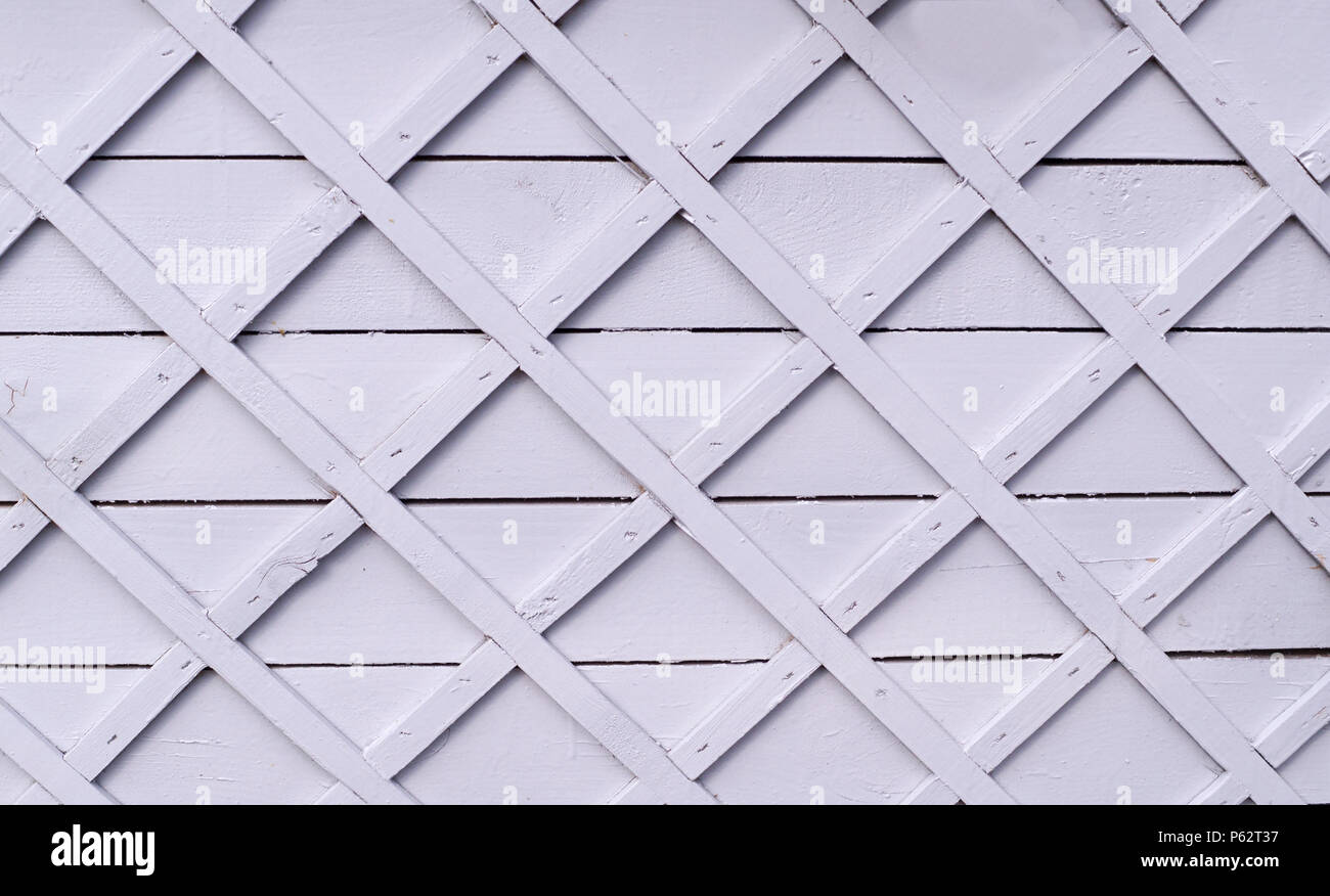 gray wooden fence with square lattice. background, texture. Stock Photo