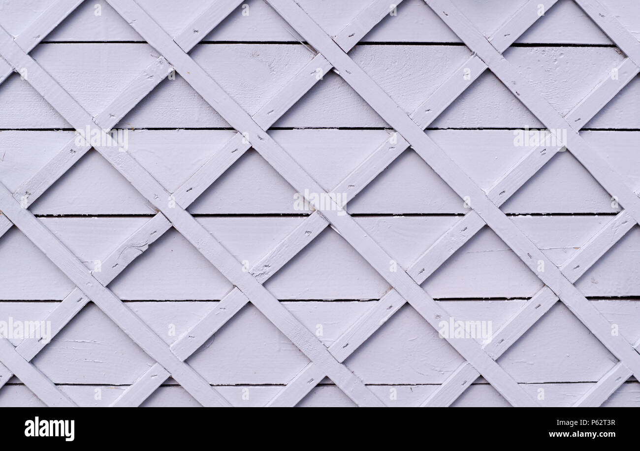 gray wooden fence with square lattice. background, texture. Stock Photo