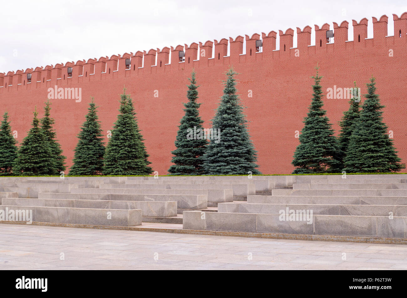 moscow kremlin red brick wall with fir-trees. background, travel Stock Photo