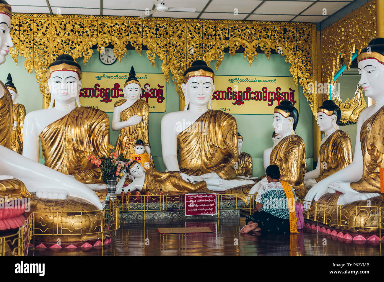 Yangon, Myanmar - FEB 19th 2014: Golden buddha statue at Shwedagon golden pagoda Stock Photo