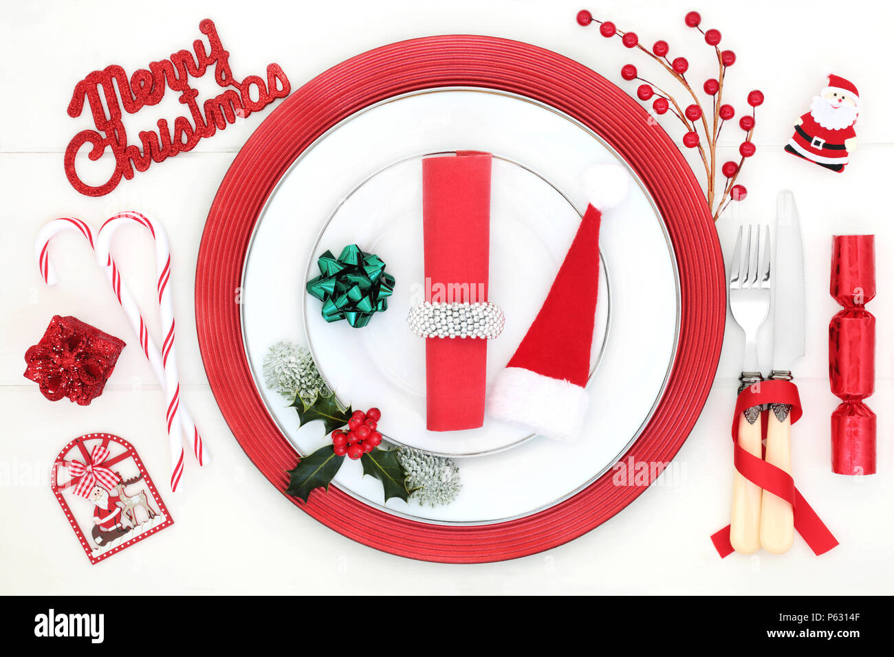 Christmas dinner table setting with porcelain plates, fun bauble ...