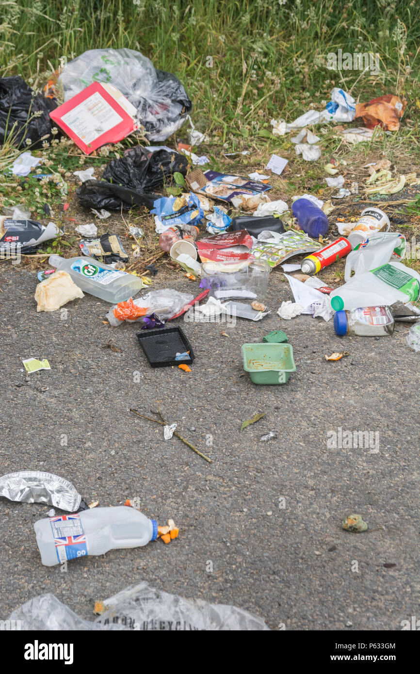 Domestic rubbish dumped / fly tipped in a car parking area. Personal