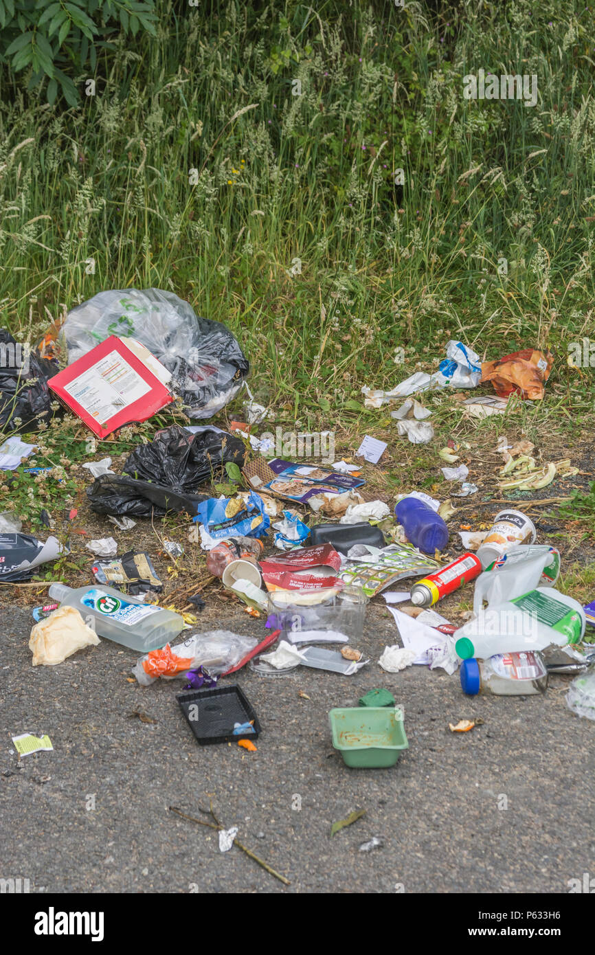 Domestic rubbish dumped / fly tipped in a car parking area. Personal