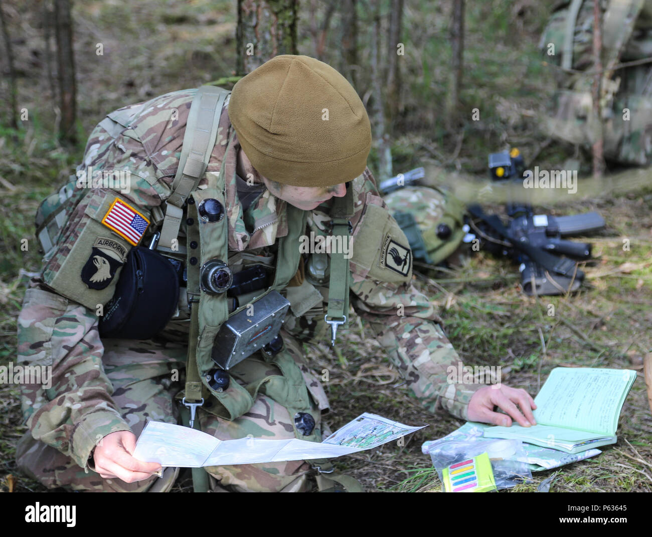 A U.S. Soldier of the 173rd Airborne updates a map while conduct a pre-missions brief during exercise Saber Junction 16 at the U.S. Army’s Joint Multinational Readiness Center (JMRC) in Hohenfels, Germany, April 13, 2016. Saber Junction 16 is the U.S. Army Europe’s 173rd Airborne Brigade’s combat training center certification exercise, taking place at the JMRC in Hohenfels, Germany, Mar. 31-Apr. 24, 2016.  The exercise is designed to evaluate the readiness of the Army’s Europe-based combat brigades to conduct unified land operations and promote interoperability in a joint, multinational enviro Stock Photo