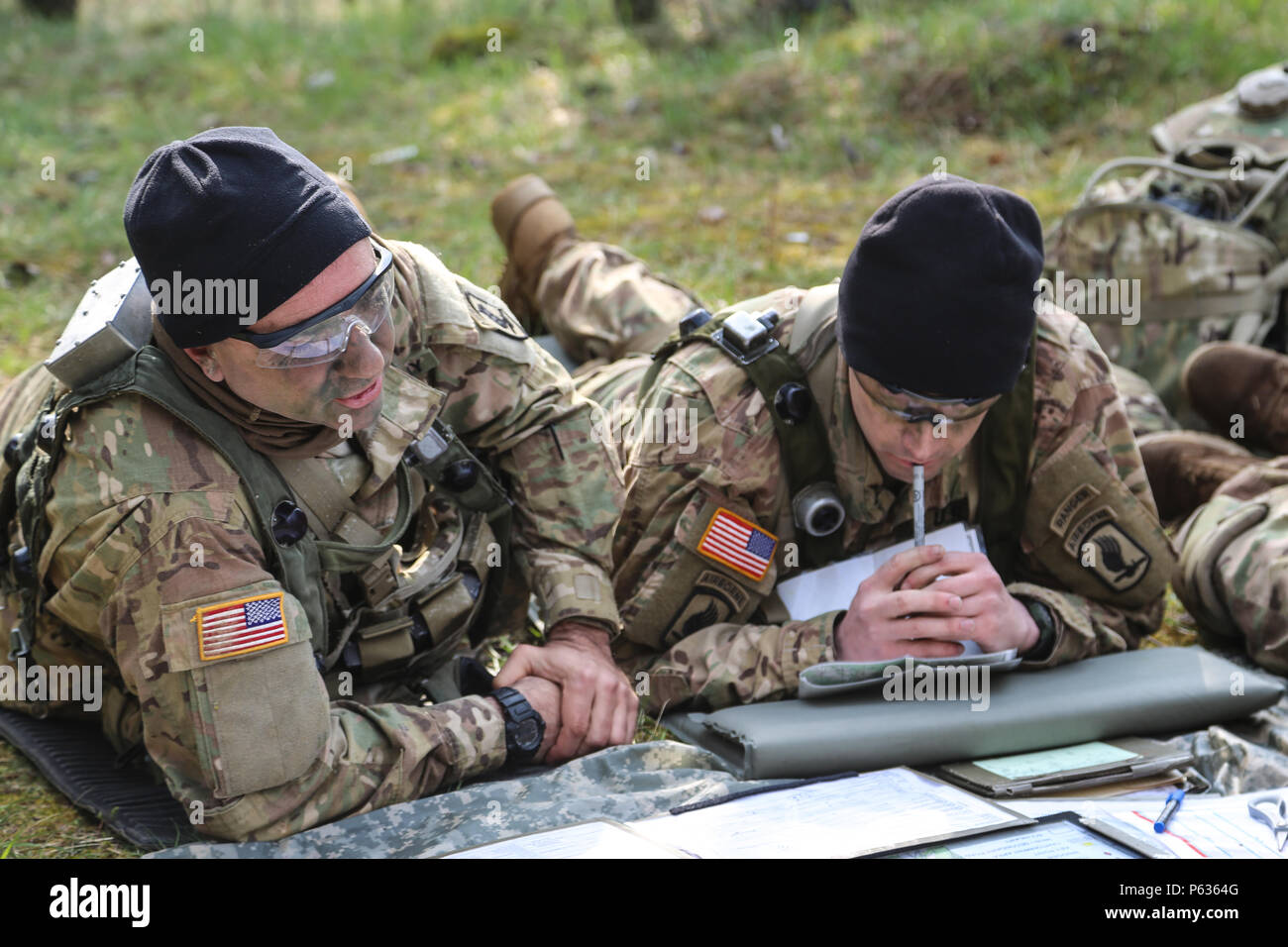 U.S. Soldiers of the 173rd Airborne Brigade discuss mission updates while conducting a pre-mission brief during exercise Saber Junction 16 at the U.S. Army’s Joint Multinational Readiness Center (JMRC) in Hohenfels, Germany, April 14, 2016. Saber Junction 16 is the U.S. Army Europe’s 173rd Airborne Brigade’s combat training center certification exercise, taking place at the JMRC in Hohenfels, Germany, Mar. 31-Apr. 24, 2016.  The exercise is designed to evaluate the readiness of the Army’s Europe-based combat brigades to conduct unified land operations and promote interoperability in a joint, m Stock Photo