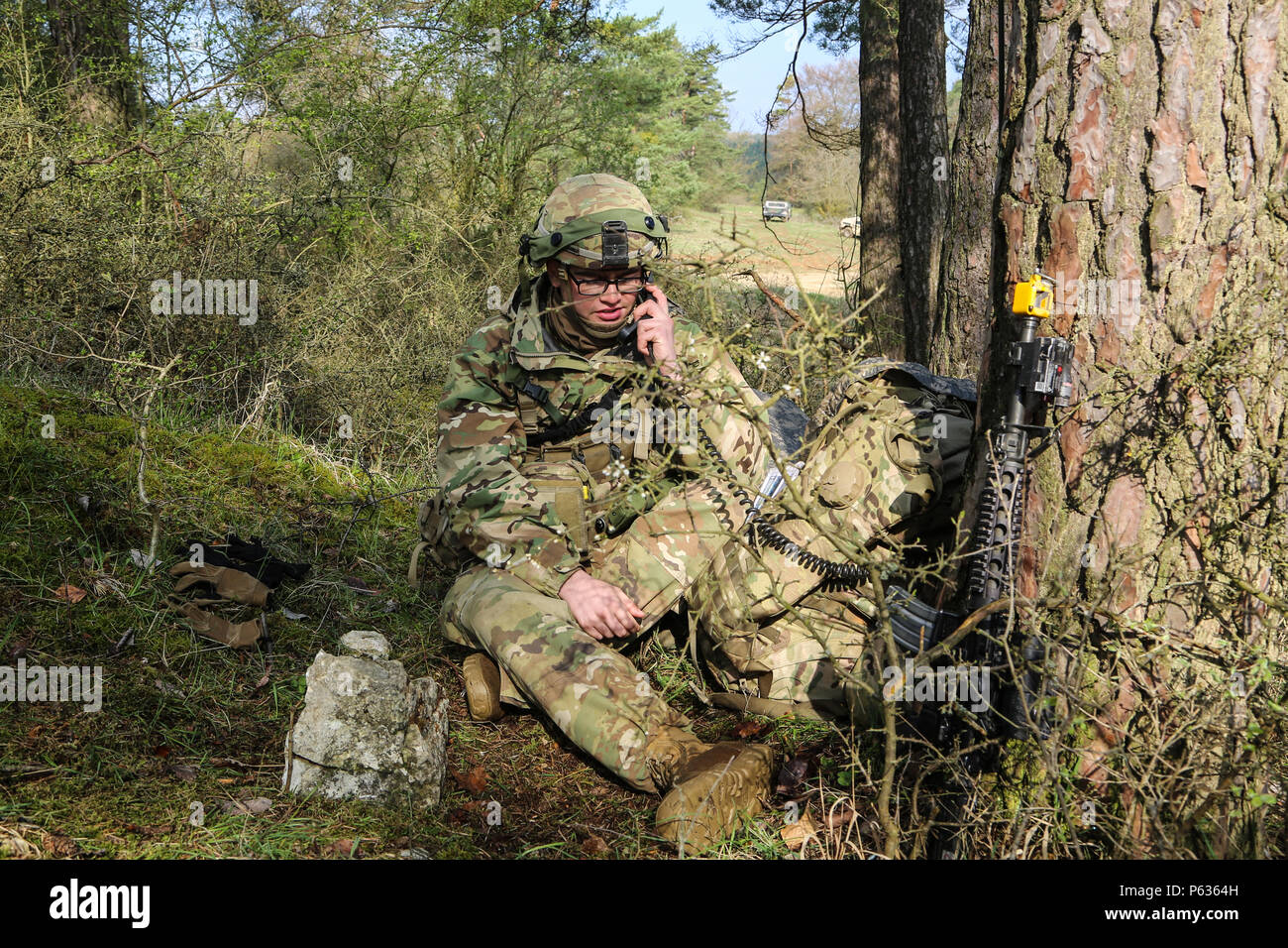 A U.S. Soldier of the 173rd Airborne Brigade transmits mission updates as part of tactical operations during exercise Saber Junction 16 at the U.S. Army’s Joint Multinational Readiness Center (JMRC) in Hohenfels, Germany, April 14, 2016. Saber Junction 16 is the U.S. Army Europe’s 173rd Airborne Brigade’s combat training center certification exercise, taking place at the JMRC in Hohenfels, Germany, Mar. 31-Apr. 24, 2016.  The exercise is designed to evaluate the readiness of the Army’s Europe-based combat brigades to conduct unified land operations and promote interoperability in a joint, mult Stock Photo