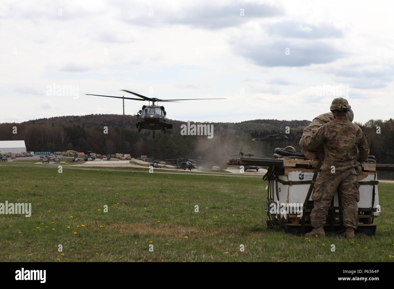 U.S. Soldiers of Charlie Company, 3rd Battalion, 227th Aviation Regiment 'Spearhead' prepare to conduct sling load operations with an UH-60 Black Hawk helicopter during exercise Saber Junction 16 at the U.S. Army’s Joint Multinational Readiness Center (JMRC) in Hohenfels, Germany, April 13, 2016. Saber Junction 16 is the U.S. Army Europe’s 173rd Airborne Brigade’s combat training center certification exercise, taking place at the JMRC in Hohenfels, Germany, Mar. 31-Apr. 24, 2016.  The exercise is designed to evaluate the readiness of the Army’s Europe-based combat brigades to conduct unified l Stock Photo