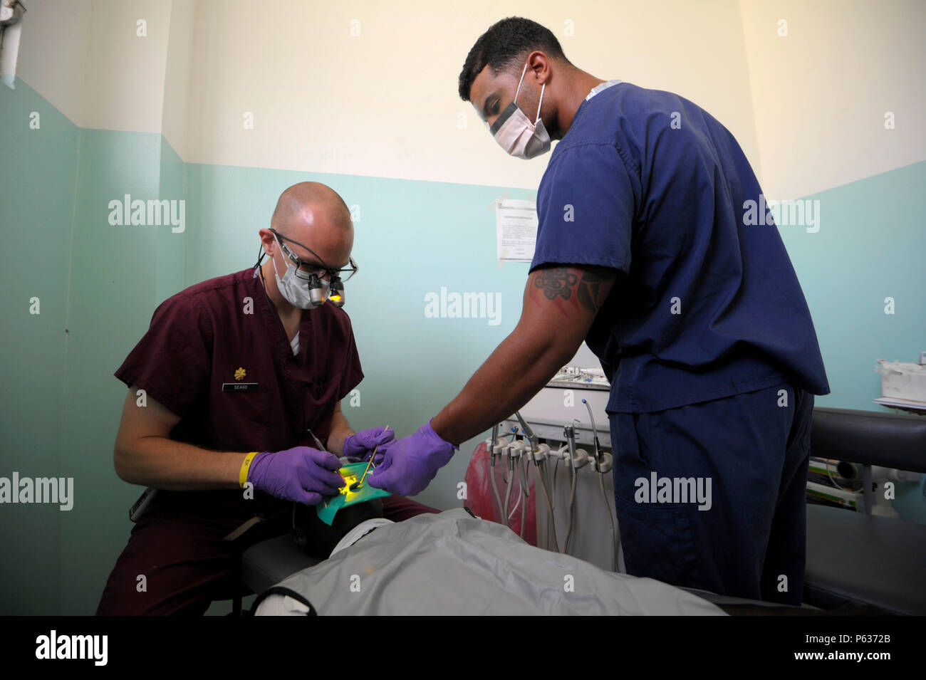 Maj. Scott Seago with dental assistant Senior Airmen Juan Melendez