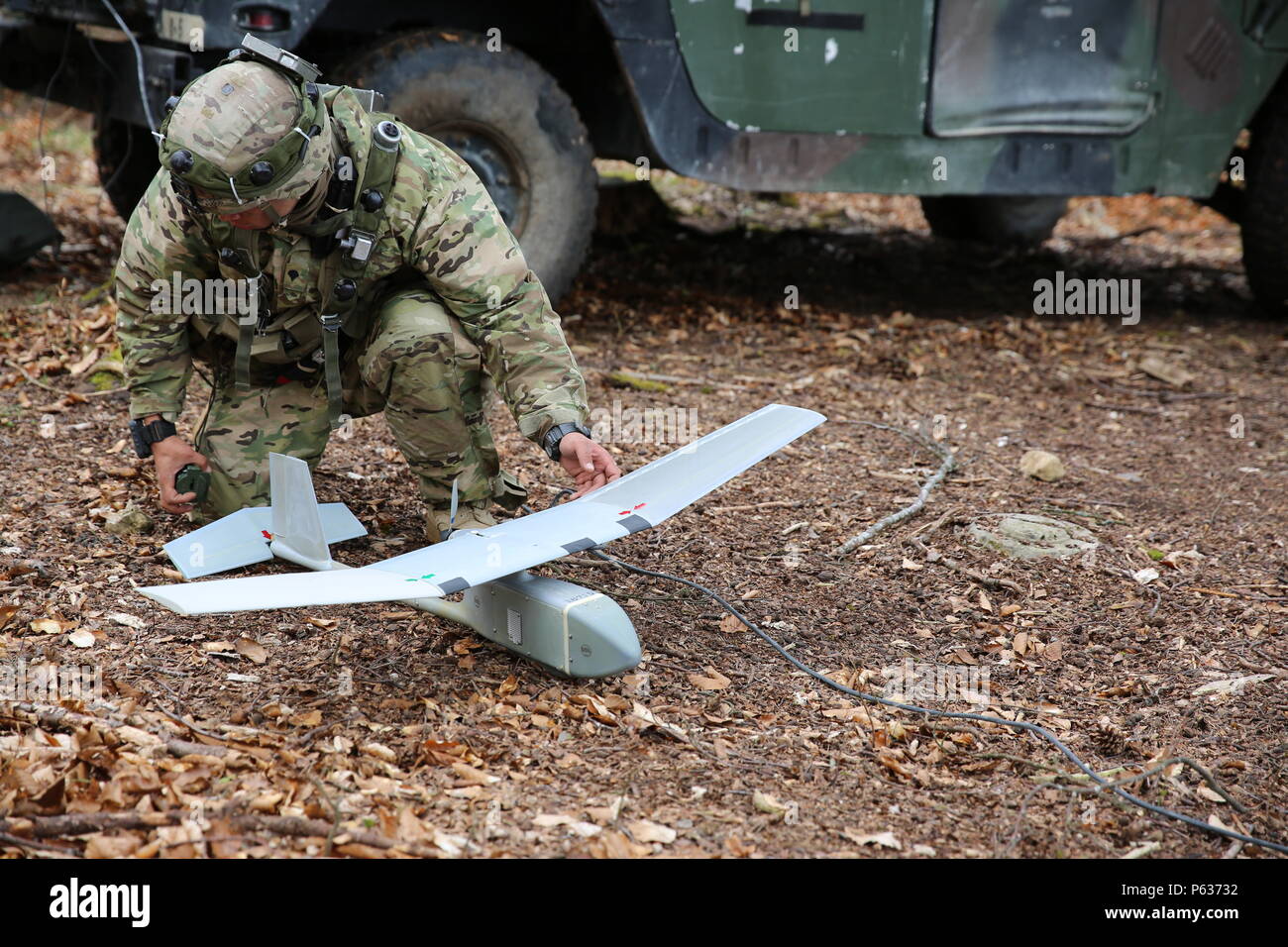 A U.S. Soldier of Bulldog Troop, 1st Squadron, 91st Cavalry Regiment, 173rd Airborne Brigade prepares a RQ-11 Raven unmanned aerial vehicle while conducting an aerial reconnaissance training mission during exercise Saber Junction 16 at the U.S. Army’s Joint Multinational Readiness Center (JMRC) in Hohenfels, Germany, April 13, 2016. Saber Junction 16 is the U.S. Army Europe’s 173rd Airborne Brigade’s combat training center certification exercise, taking place at the JMRC in Hohenfels, Germany, Mar. 31-Apr. 24, 2016.  The exercise is designed to evaluate the readiness of the Army’s Europe-based Stock Photo