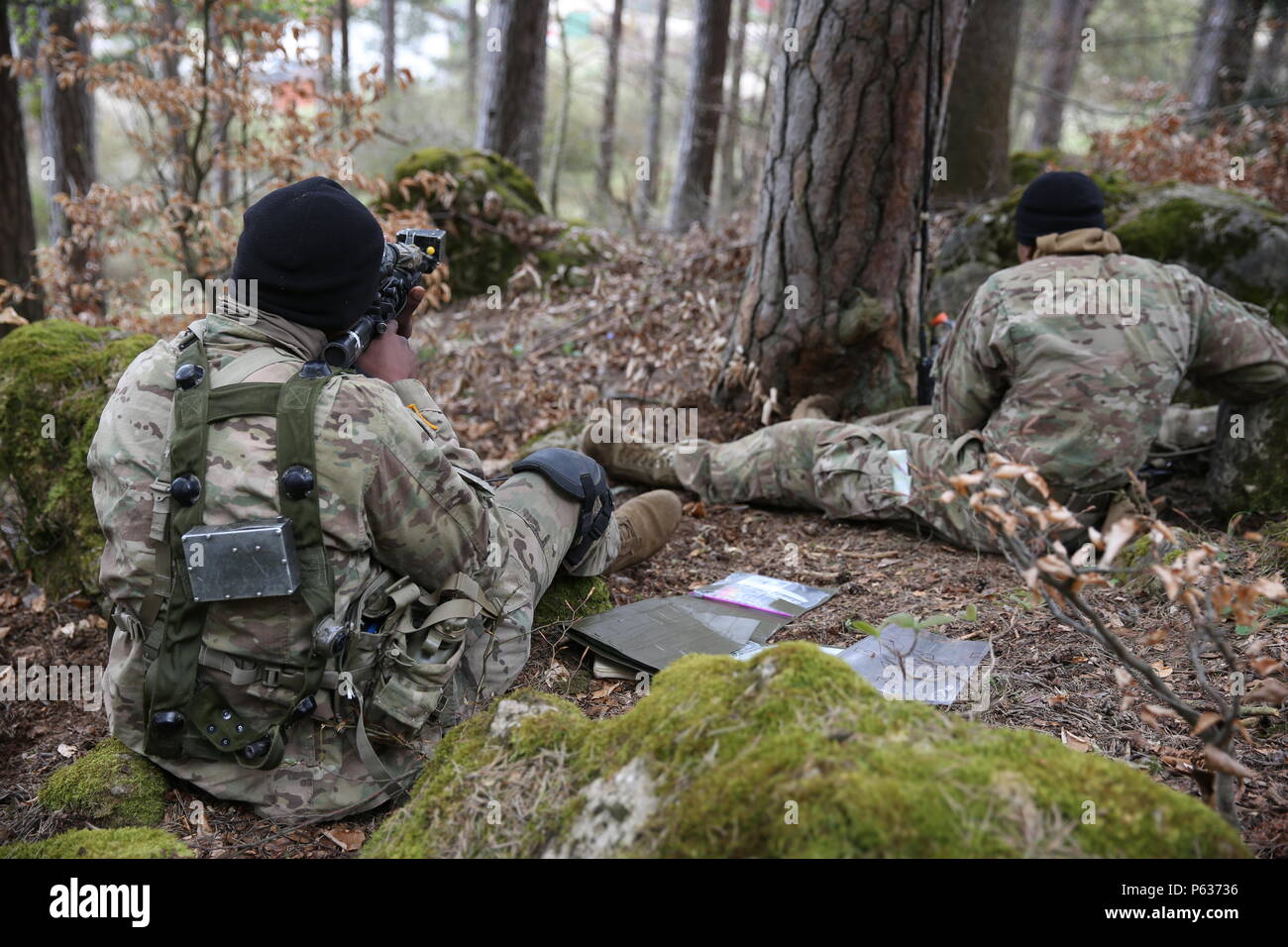 U.S. Soldiers of Bulldog Troop, 1st Squadron, 91st Cavalry Regiment, 173rd Airborne Brigade scout their objective while conducting reconnaissance operations during exercise Saber Junction 16 at the U.S. Army’s Joint Multinational Readiness Center (JMRC) in Hohenfels, Germany, April 13, 2016. Saber Junction 16 is the U.S. Army Europe’s 173rd Airborne Brigade’s combat training center certification exercise, taking place at the JMRC in Hohenfels, Germany, Mar. 31-Apr. 24, 2016.  The exercise is designed to evaluate the readiness of the Army’s Europe-based combat brigades to conduct unified land o Stock Photo