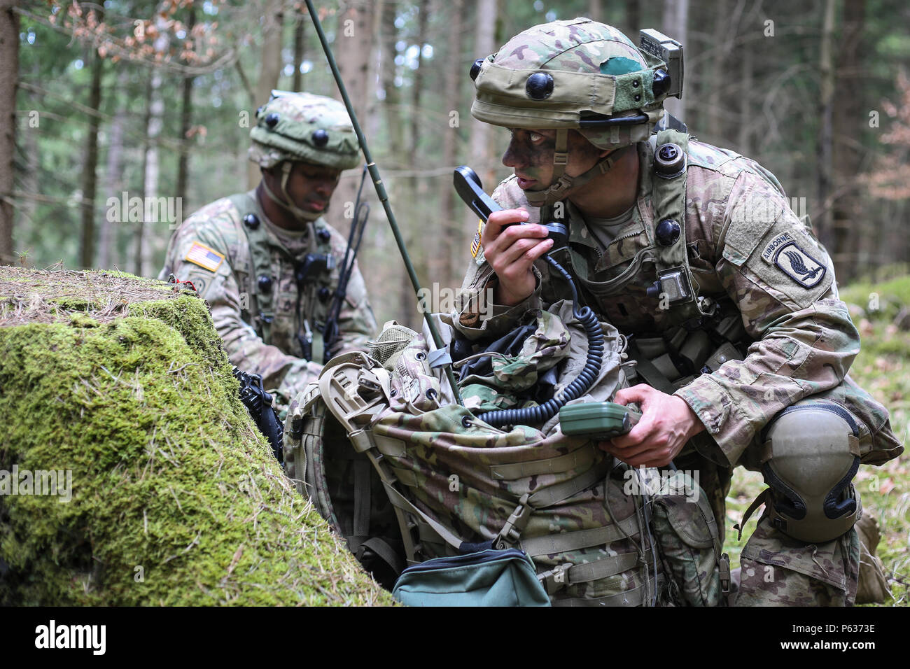 U.S. Army 1st Lt. Vincent Marcantonio, right, and Staff Sgt. Justin Johnson of Headquarters and Headquarters Battalion, 173rd Airborne Brigade conducts movement to contact scenario during exercise Saber Junction 16 at the U.S. Army’s Joint Multinational Readiness Center (JMRC) in Hohenfels, Germany, April 13, 2016. Saber Junction 16 is the U.S. Army Europe’s 173rd Airborne Brigade’s combat training center certification exercise, taking place at the JMRC in Hohenfels, Germany, Mar. 31-Apr. 24, 2016.  The exercise is designed to evaluate the readiness of the Army’s Europe-based combat brigades t Stock Photo