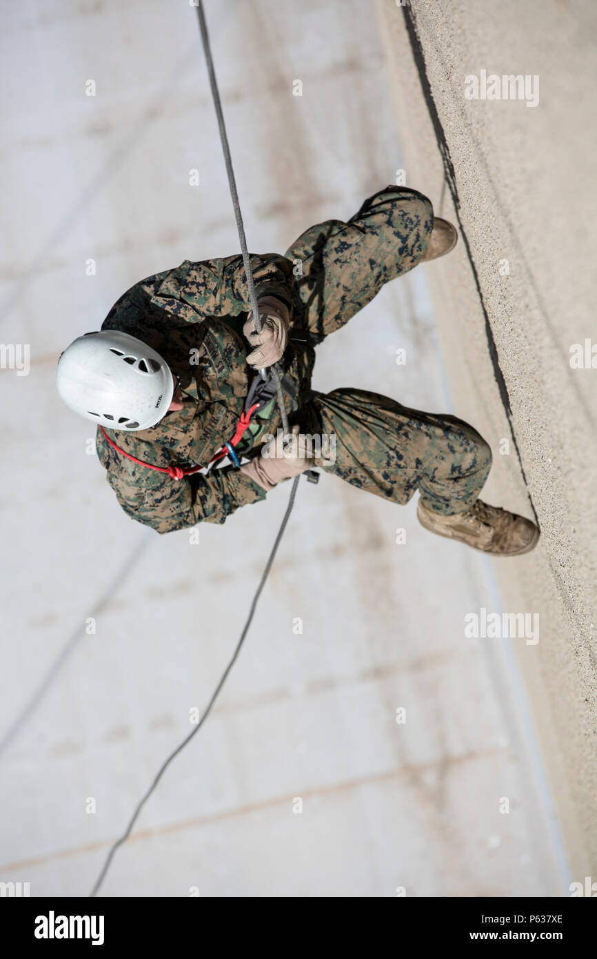 U.S. Marine Corps Lance Cpl. Ryan K. Smith, rifleman with Bravo company, 1st Battalion, 8th Marine Regiment, Special Purpose Marine Air-Ground Task Force-Crisis Response-Africa rappels from a ten-story building during a zip lining and rappelling training event in Osseja, France, Apr. 6, 2016. French Commando training is part of the partnership SPMAGTF-CR-AF Marines maintain with European allies to help enable and sustain crisis response. (U.S. Marine Corps photo by Sgt. Kassie L. McDole/Released) Stock Photo