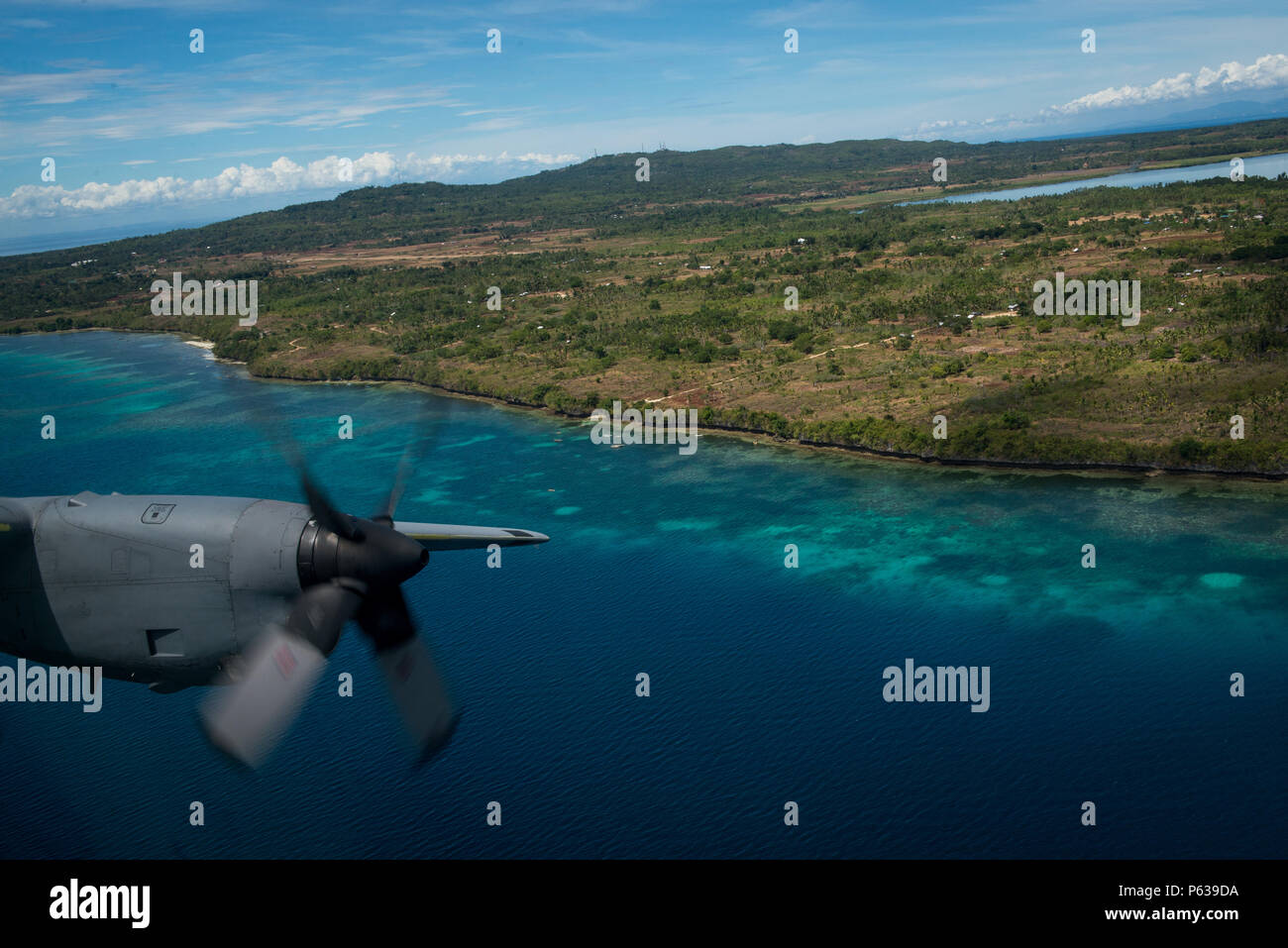 A 36th Airlift Squadron C130 Hercules flies off the coast of Cebu