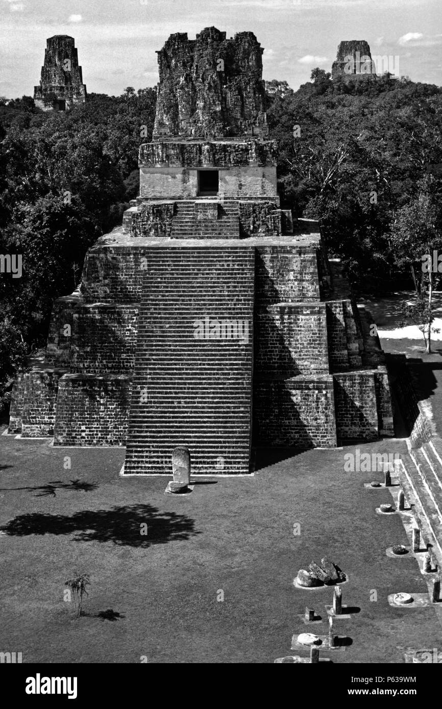 MAYA TEMPLE II, 125 ft. tall and dating to 700 AD, rising out of the PETEN JUNGLE - TIKAL, GUATEMALA Stock Photo