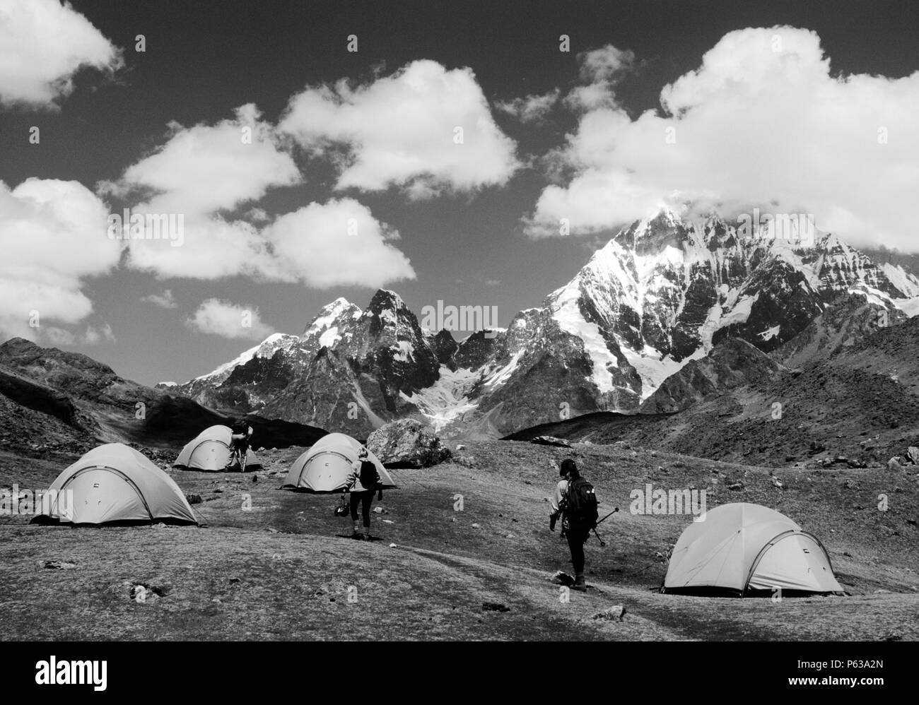 Camping on the NEVADO AUZANGATE CIRCUIT below the mighty peak - PERUVIAN ANDES Stock Photo