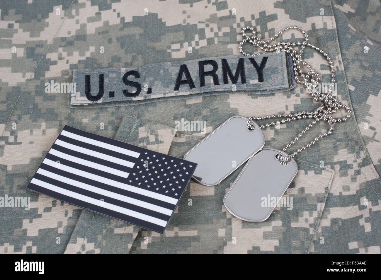 US flag patch with dog tag on Army Combat Uniform background Stock ...