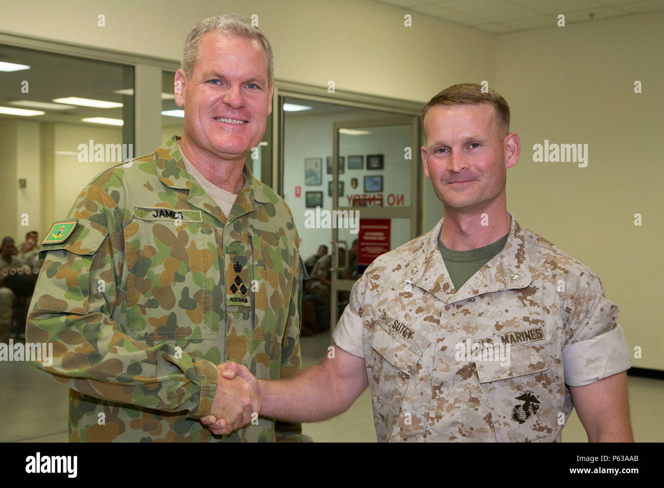 Australian Army officer Brigadier Ben James, left), AM, DSM, Commander of  1st Brigade, welcomes Lieutenant Colonel Steven M Sutey, Commanding Officer  of Marine Rotational Force – Darwin, to the Top End on