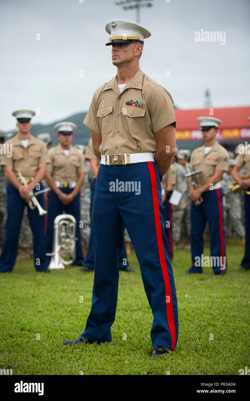 The U.S. Marine Corps Forces Pacific band, led by a band officer, performs  during the annual Flag Day Ceremony in Pago Pago, American Samoa. Traveling  from Marine Corps Base Hawaii, the band