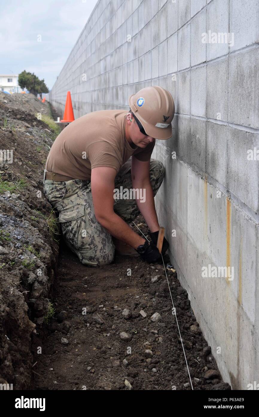 An Equipment Operator assigned to Naval Mobile Construction Battalion 4 ...
