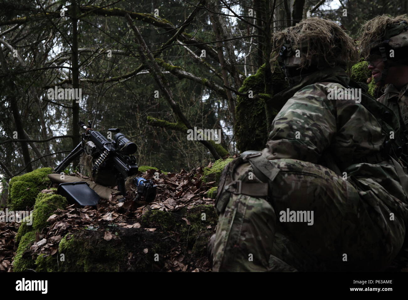 U.S. Soldiers from 2nd Battalion, 503rd Airborne Infantry Regiment, 173rd Airborne Brigade, scan their sector of fire while conducting a reconnaissance training mission during exercise Saber Junction 16 at the U.S. Army’s Joint Multinational Readiness Center (JMRC) in Hohenfels, Germany, April 15, 2016. Saber Junction 16 is the U.S. Army Europe’s 173rd Airborne Brigade’s combat training center certification exercise, taking place at the JMRC in Hohenfels, Germany, Mar. 31-Apr. 24, 2016.  The exercise is designed to evaluate the readiness of the Army’s Europe-based combat brigades to conduct un Stock Photo