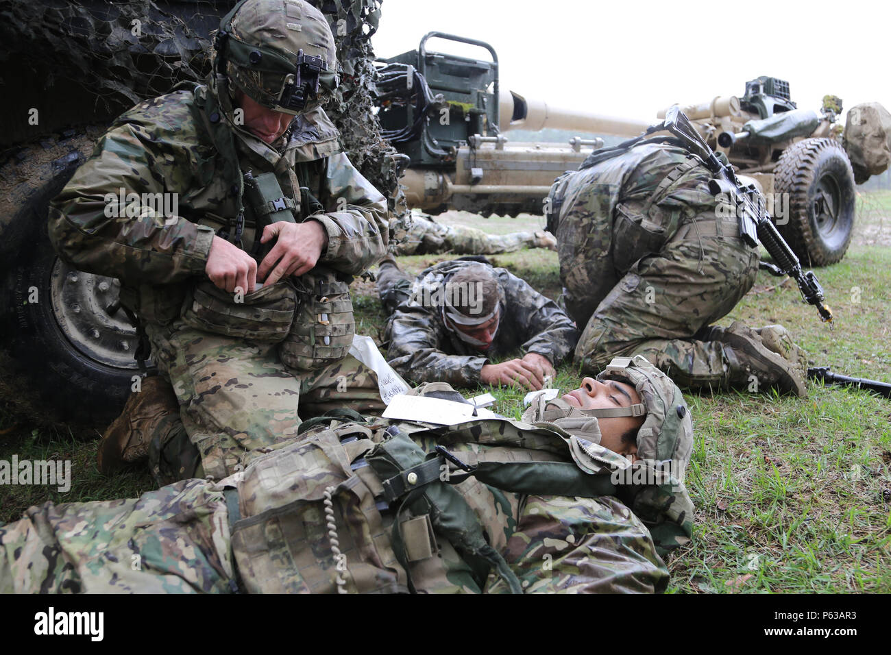 U.S. Soldiers of Alpha Company, 4th Battalion, 319th Airborne Field Artillery Regiment, 173rd Airborne Brigade provide medical aid to simulated casualties during exercise Saber Junction 16 at the U.S. Army’s Joint Multinational Readiness Center (JMRC) in Hohenfels, Germany, April 15, 2016. Saber Junction 16 is the U.S. Army Europe’s 173rd Airborne Brigade’s combat training center certification exercise, taking place at the JMRC in Hohenfels, Germany, Mar. 31-Apr. 24, 2016.  The exercise is designed to evaluate the readiness of the Army’s Europe-based combat brigades to conduct unified land ope Stock Photo